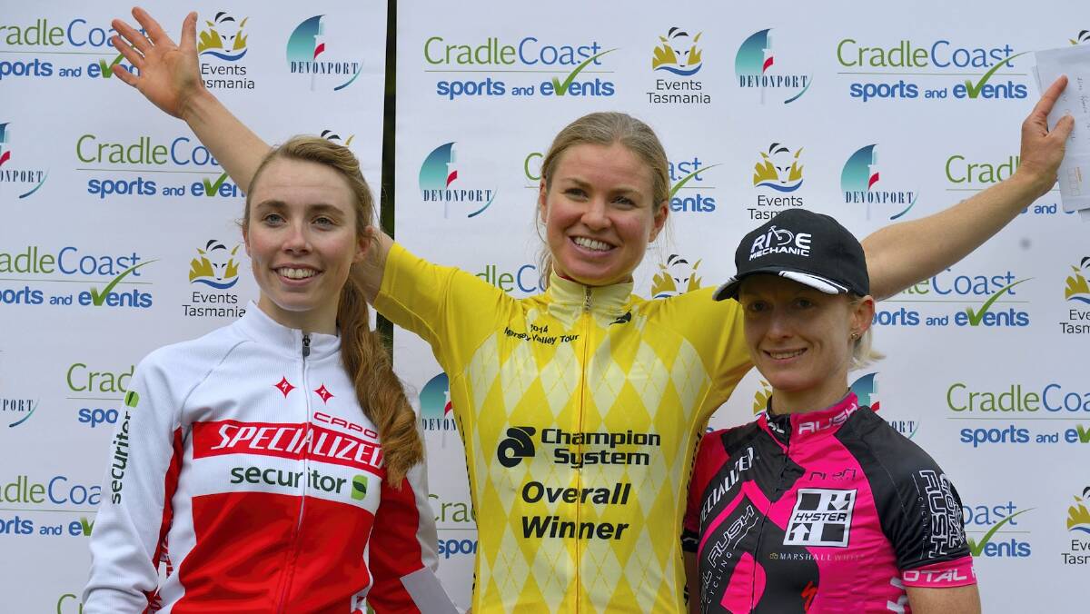 Women’s Mersey Valley Tour winner Lucy Coldwell  celebrates on the  podium after sealing her victory on Sunday. Picture: CANILUNA.