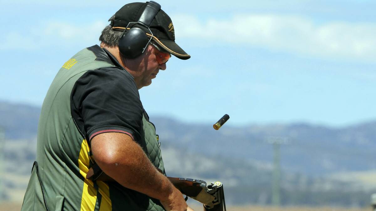 Deloraine shooter Tim Atkins ejects a shell during competition at the Tasmanian Clay Target Association state championships at Evandale yesterday. Picture: NEIL RICHARDSON