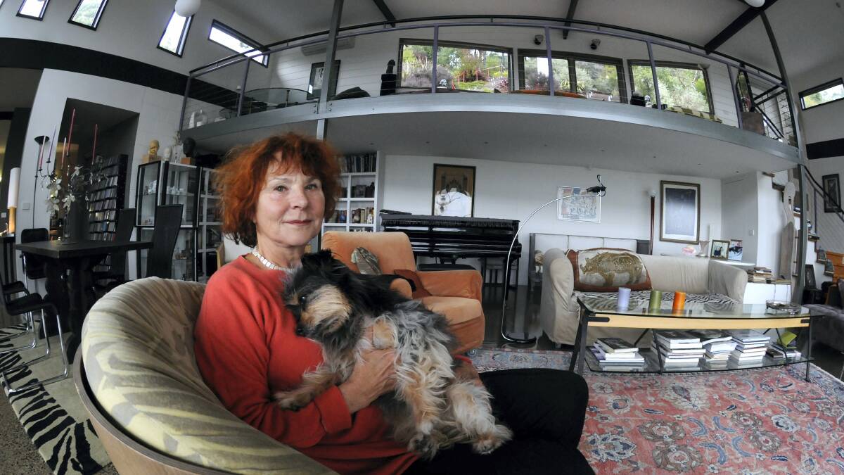Jessie Vonk relaxing with dog Billy at her Hans Vonk Music House in Spreyton. Picture: PAUL SCAMBLER