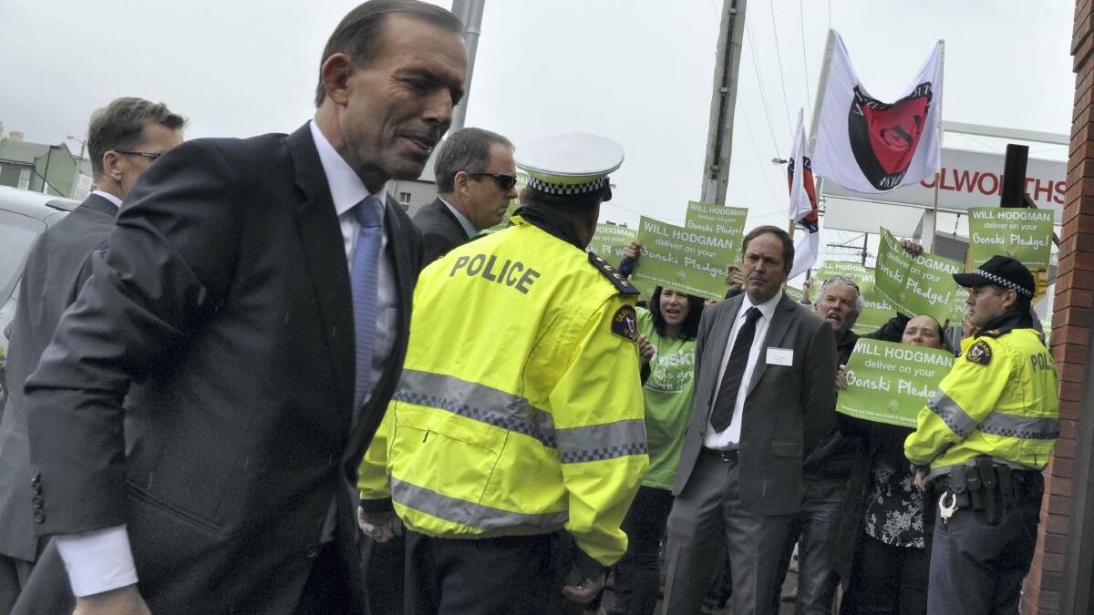 Protesters angry about education funding policies confront Prime Minister Tony Abbott in Hobart. Picture: ROSEMARY BOLGER
