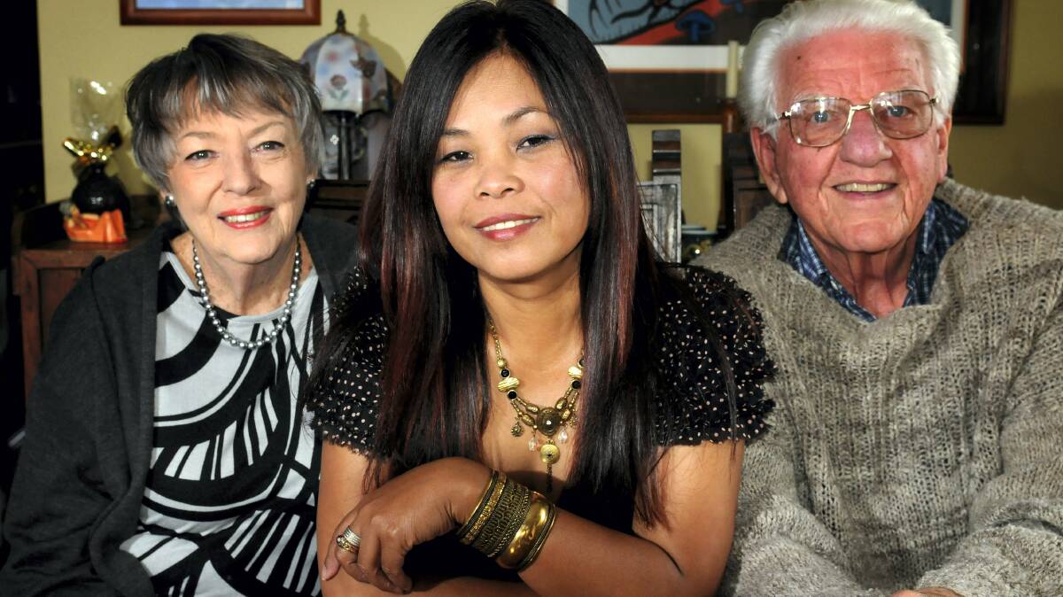 Khmer Rouge survivor Leakena Dixon is flanked by friends Alwyn and Laurie Lewis. Picture: GEOFF ROBSON