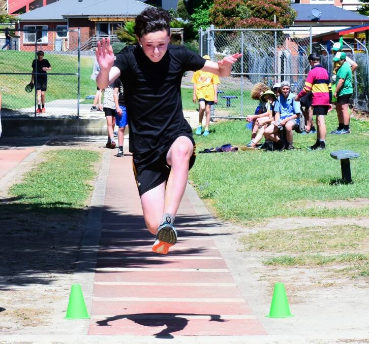 Jump to it: Thomas Reilly competing in the long jump at the Riverside High School athletics carnival at Windsor Park. Pictures: Neil Richardson