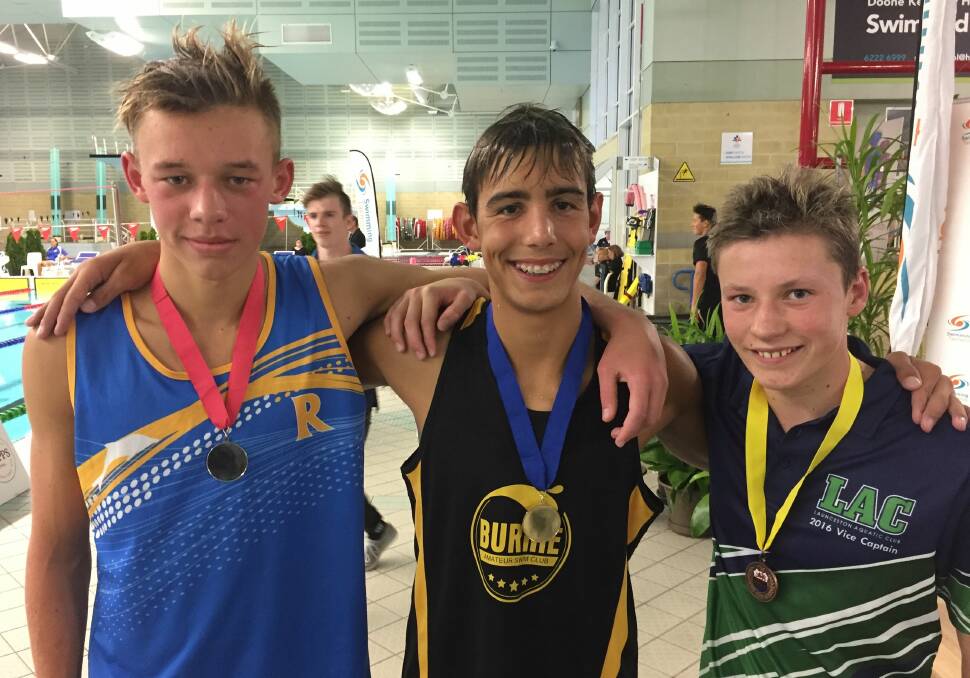 Podium #1: Kiaran Gillies, of Riverside, Ethan Stretton, of Burnie, and Edward Watson, of LAC, after the boys' 15-and-under 1500m freestyle.