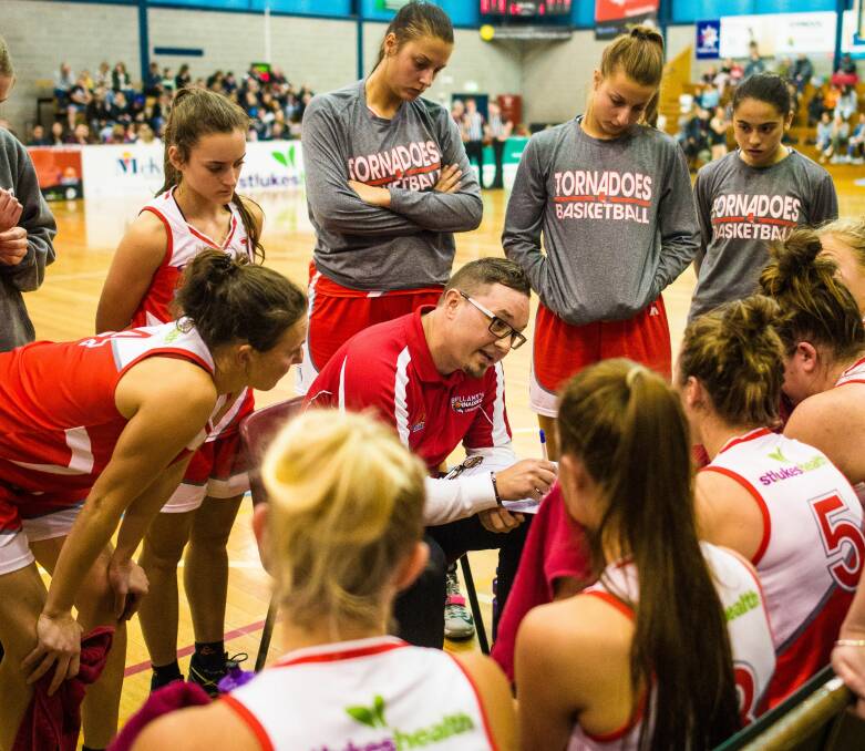 ALL EARS: New Tornadoes coach Richard Dickel instructs his players during the game against Dandenong Rangers in Launceston on Saturday. Picture: Scott Gelston.