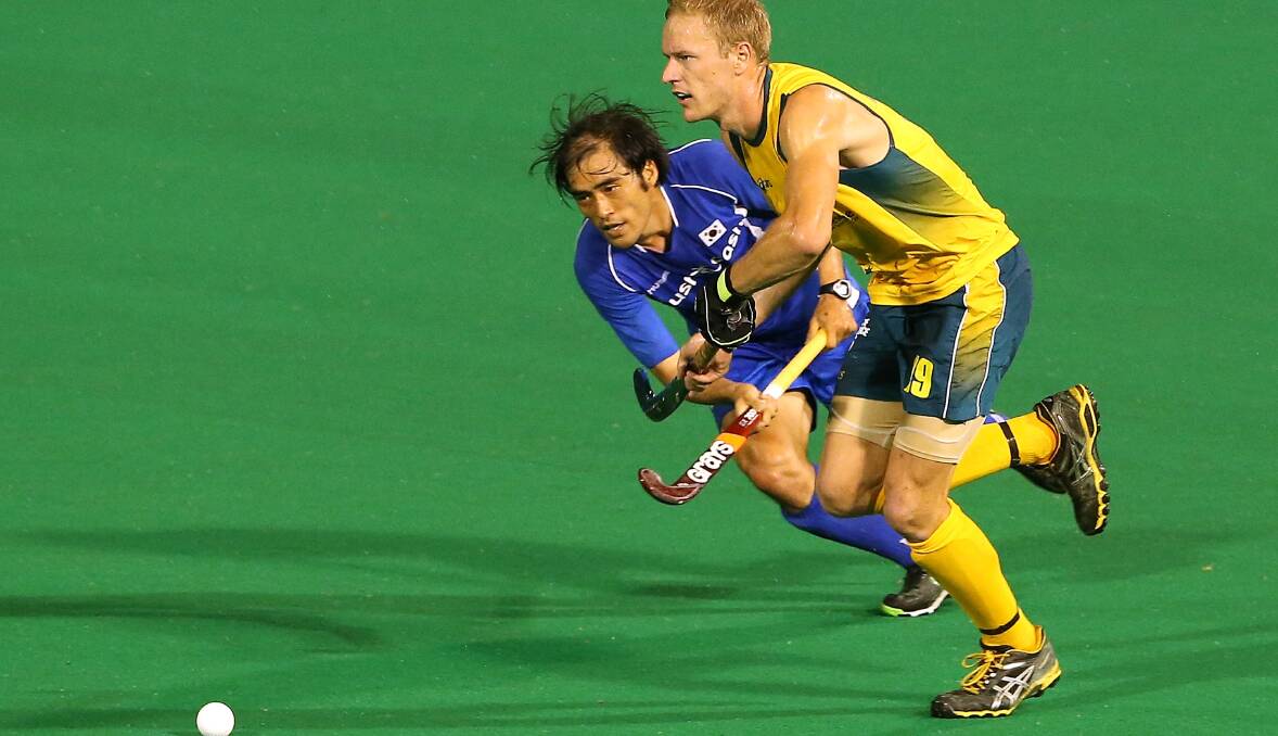 Heads up: Tim Deavin in full flight for the Kookaburras. Picture: Getty Images