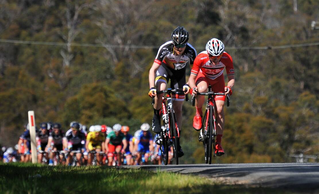On the rise: Jai Crawford (right) leads the 2014 Tour of Tasmania out of Launceston.