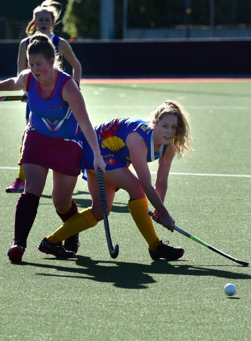 Contact sport: South Burnie's Mel Scolyer and South Launceston Suns' Alice Davies in action last weekend. Picture: Paul Scambler