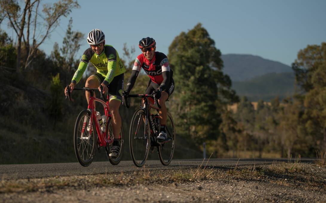 Reasons to be cheerful: George Hyde and Richie Porte keep smiling on one of their shared Tasmanian rides. Picture: Scott Gelston