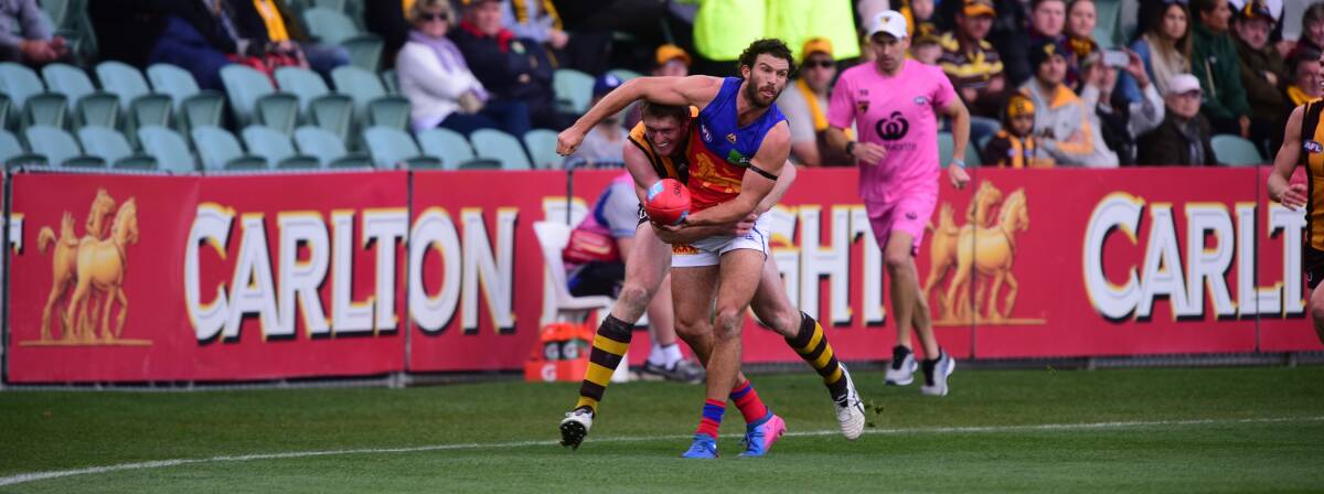 Gotcha: Hawk Ben McEvoy tackles Brisbane's Rohan Bewick.