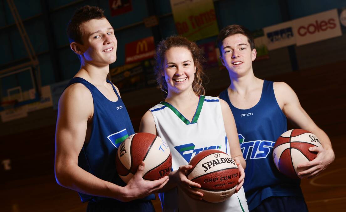 Tanner Krebs, 17, Liz Howe, 16 and Kai Woodfall, 16, off to a national basketball camp in 2013.