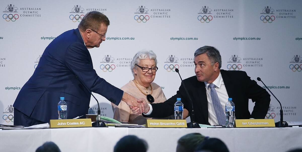 Shake-up: Australian Olympic Committee president John Coates congratulates Ian Chesterman and Helen Brownlee on their election as vice-presidents. Picture: Getty Images