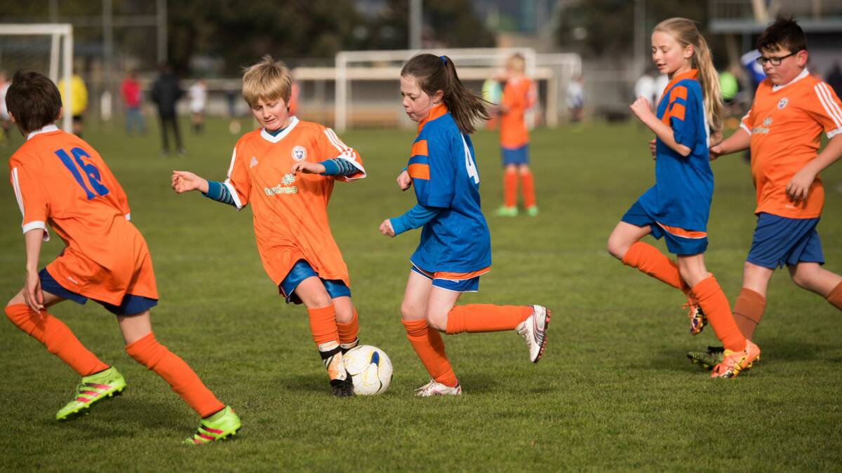Junior players from Riverside Olympic enjoy their weekly fix of Churchill Park.