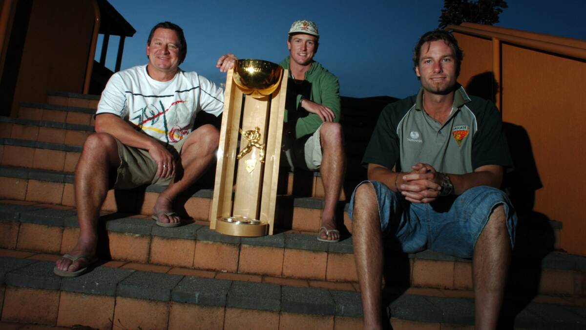 Step up: Griffith (right) with Tasmanian Tigers coach Tim Coyle and teammate George Bailey after winning the Pura Cup in 2007.