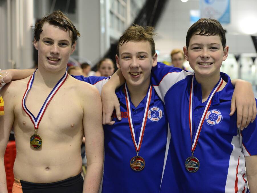 Medal detectors: Men 13s 50m backstroke medallists Jackson Devine, of Hobart Aquatic (first), and South Esk's William Hinds (third) and Angus Robertson (second).