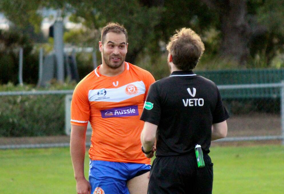 Ticked off: Michael Monticchio introduces himself to the referee during Riverside's match with Kingborough. Picture: Hamish Geale