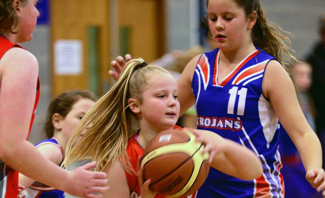 Pass master: The Southern Wolves' Sidonie Skelly in action against Trojans in a junior basketball tournament at Elphin Sports Centre on June 11.