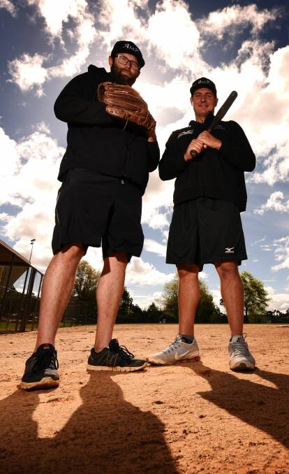 ON THE MOUND: Two of the most recognisable softballers in the world, Adam Folkard and Zenon Winters, prepare for Tassie Fastpitch Classic on Friday. Picture: Scott Gelston