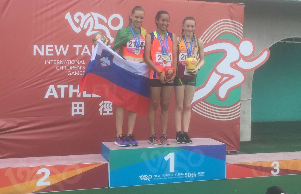 Medal detector: Launceston's Arabella Phillips (right) on the podium after winning bronze in the 400 metres.