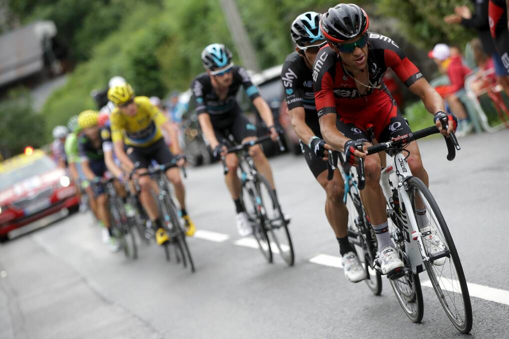 Lead role: Richie Porte leads Chris Froome and the peloton towards Mont Blanc during stage 19 of last year's Tour de France. Picture: Getty Images