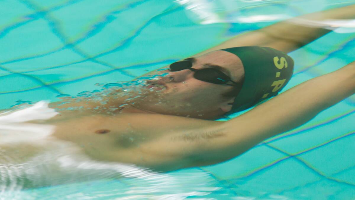 Looking up: Ethan Best during the open boys' 50m backstroke.