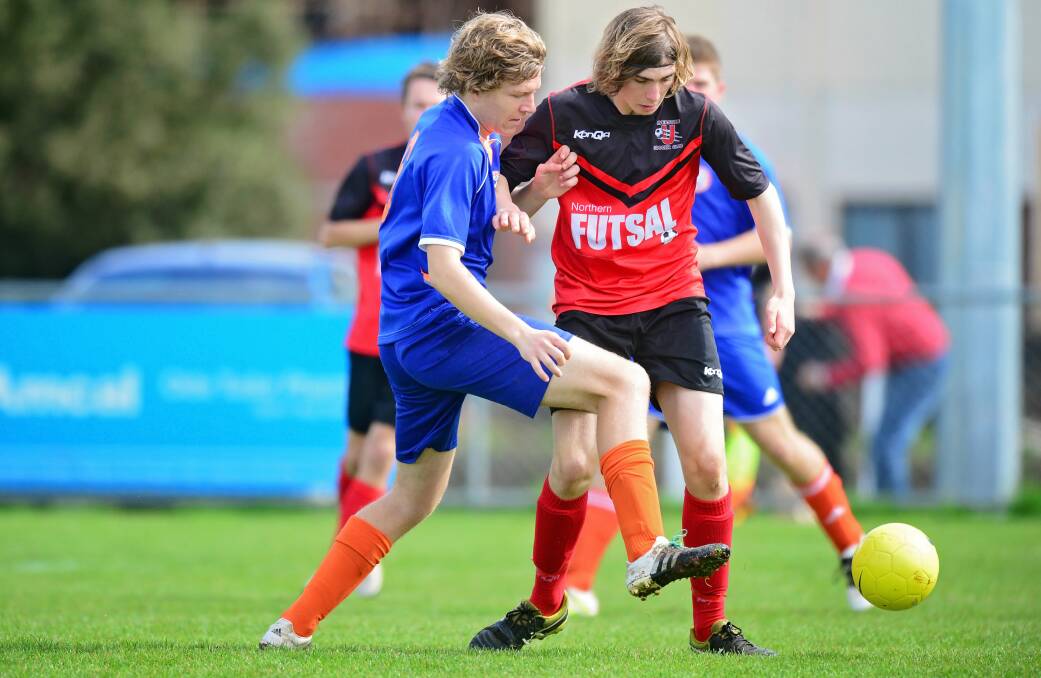 United stand: Riverside Olympic's Jake Weeding takes on Ulverstone at Launceston United's Birch Avenue in the 2016 Launceston Tournament.