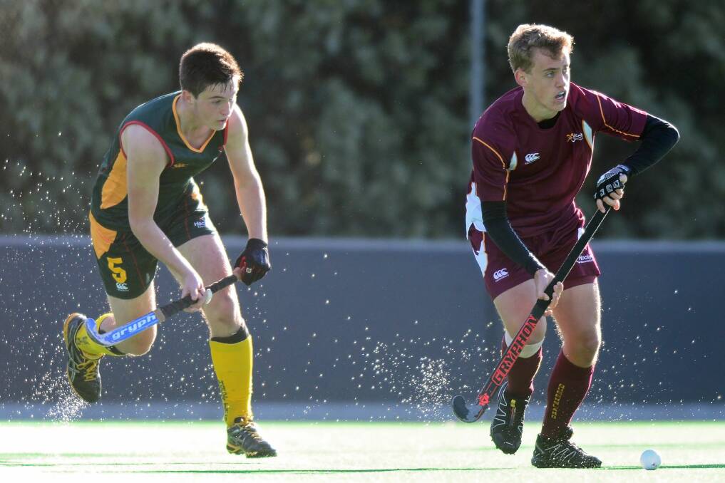 Stepping up: Tasmanian Finn Bailey, chasing Queensland's Roy Tucker at the 2016 national under-18 championship at St Leonards, has now earned selection in the state under-21s. Picture: Phillip Biggs