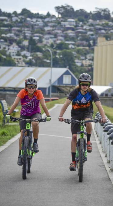 Pedal power: Enduro riders Rowena Fry and Ewan Ferrier training in Launceston. Picture: Paul Scambler