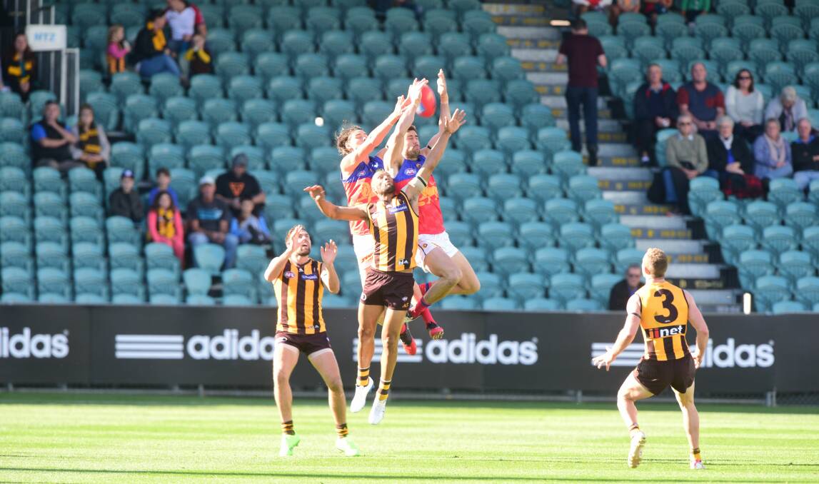 Uncrowded house: The empty seats at Saturday's Hawthorn-Brisbane match in Launceston were replicated from Sydney to Shanghai. Picture: Paul Scambler