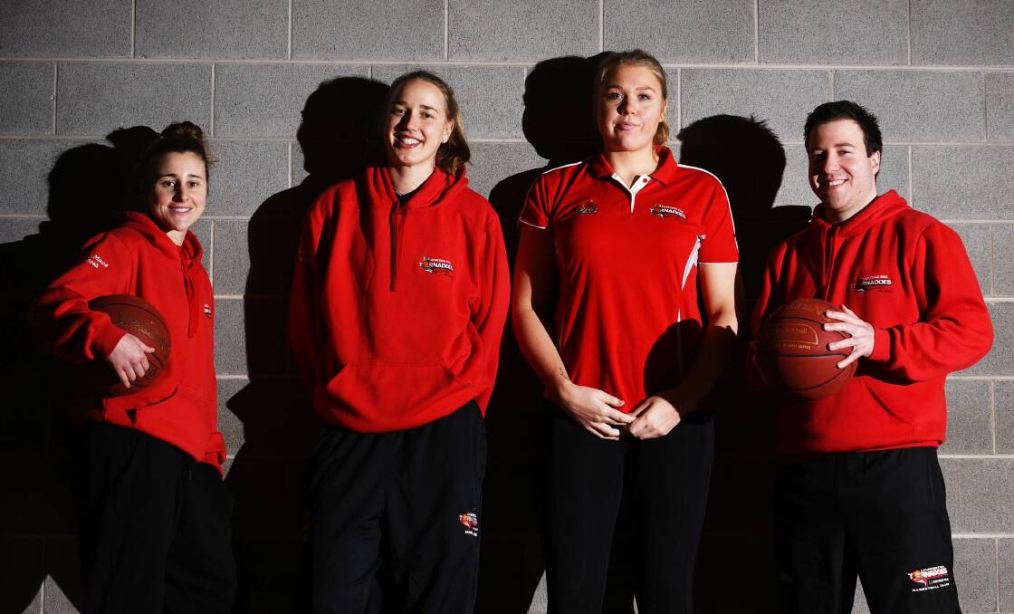 In the red: Torns teammates Lauren Mansfield, Mikaela Ruef, Tayla Roberts and coach Reece Potter have all stepped up to the WNBL.