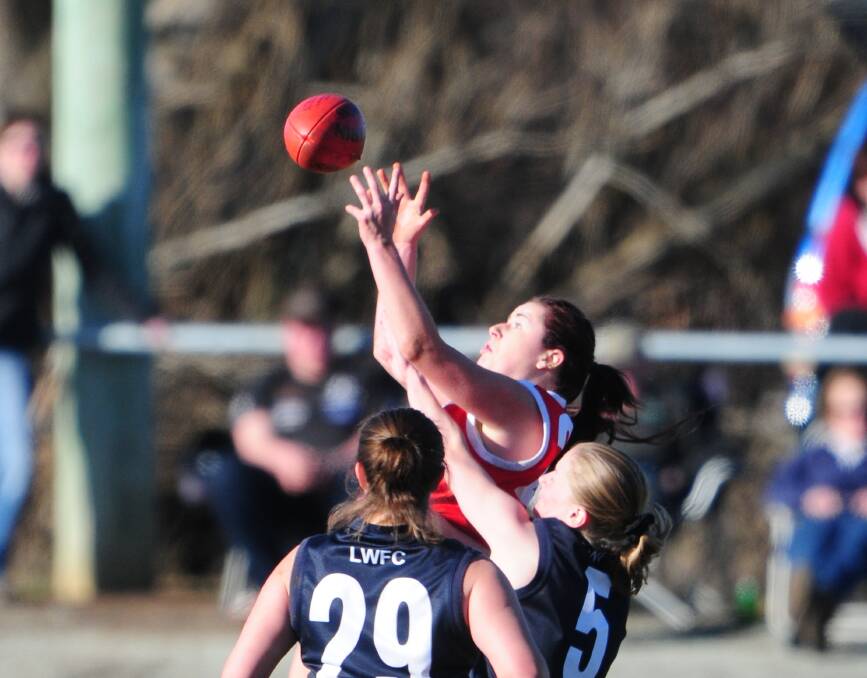 Grabbed opportunity: Jessica Wuetschner taking a mark for Clarence against Launceston in 2011.