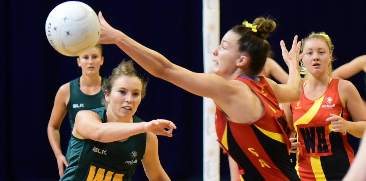Pass mark: Kelsie Rainbow playing for Tasmania against South Australia at the 21-and-under national netball championships in Launceston in March.
