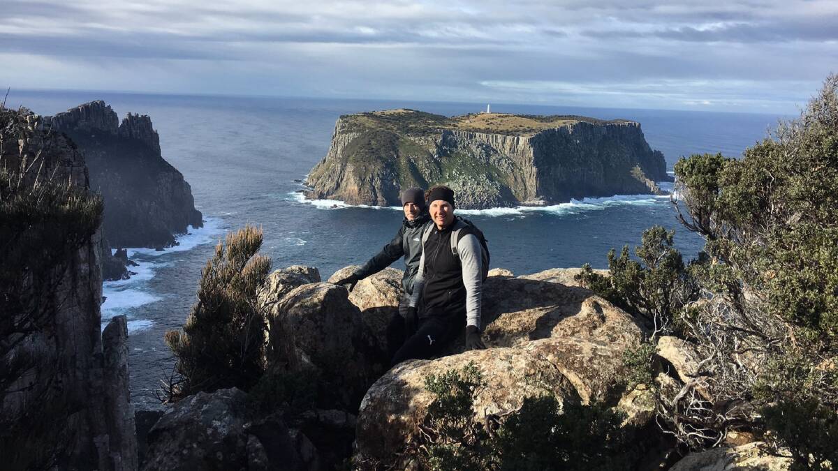 Facing the drop: Cricket Tasmania talent manager Ben Rohrer and Tigers head coach Adam Griffith take in views of Tasman Island on the Three Capes Track. Picture: Twitter