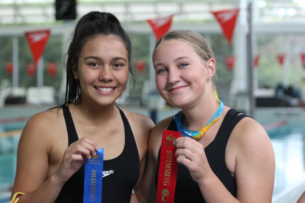 Victorious: Grade 9 champion Eliza Matthews and Angie Collins display their ribbons.