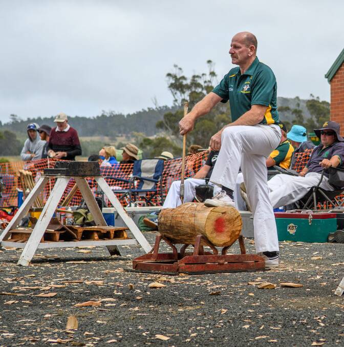 Tucking in: Mick Tucker has been rolling back the years this woodchopping season. Picture: Scott Gelston.