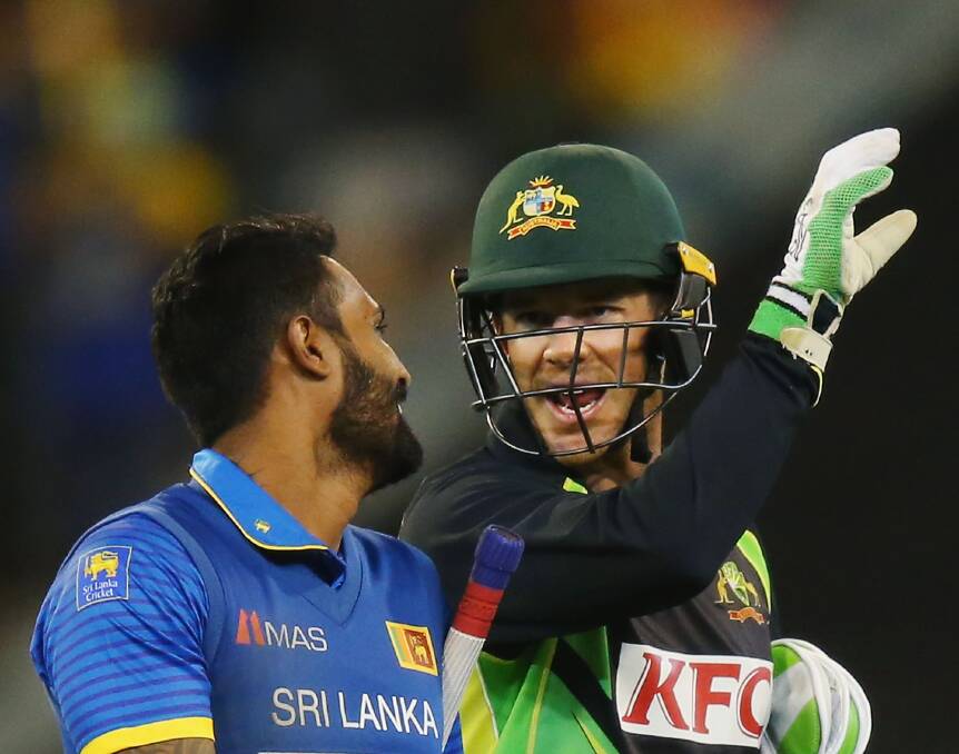 Timmy time: Tim Paine chats with Chamara Kapugedera during the Twenty20 international between Australia and Sri Lanka this week. Picture: Getty Images