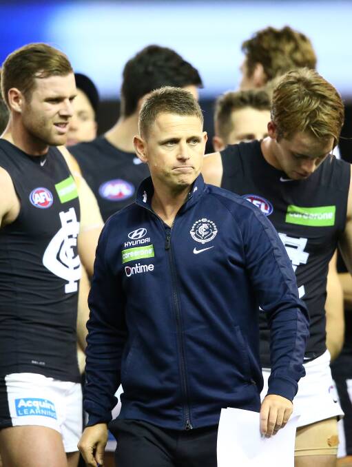 COMMUNICATOR: First-year Blues coach Brendon Bolton emerges from a quarter-time huddle after addressing his players. Picture: Getty Images