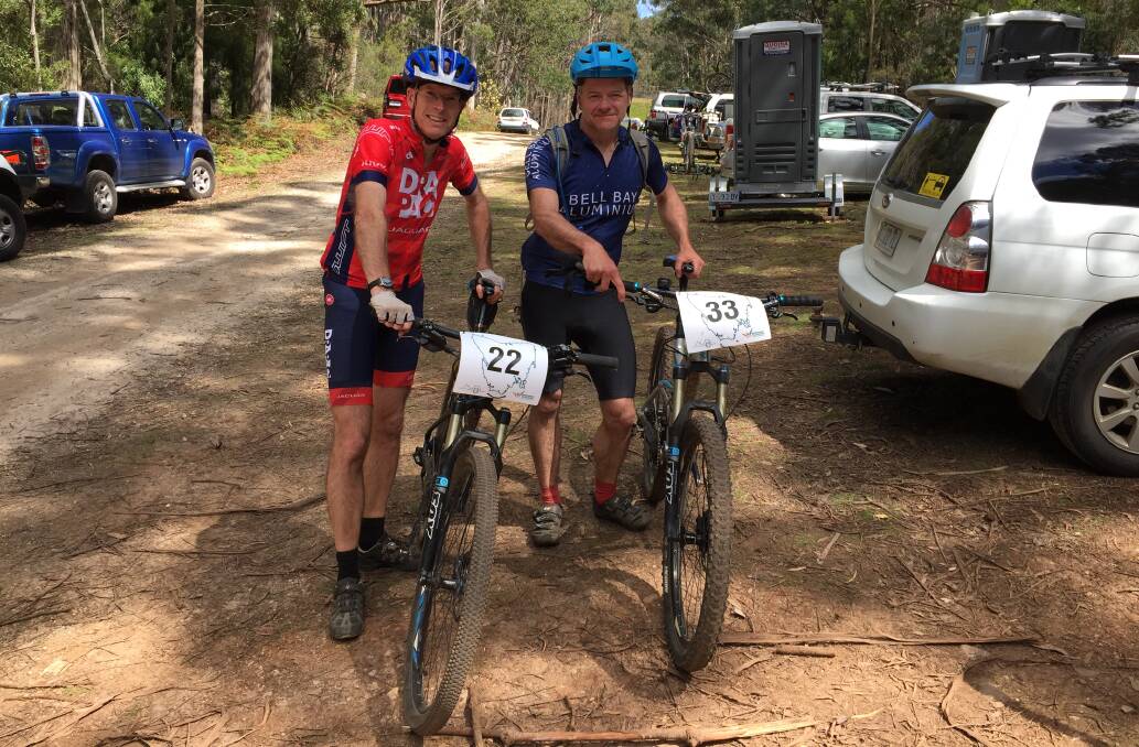 Australian Masters Games rival mountain bikers Rob Shaw and Pete Millar at Kelcey Tier.