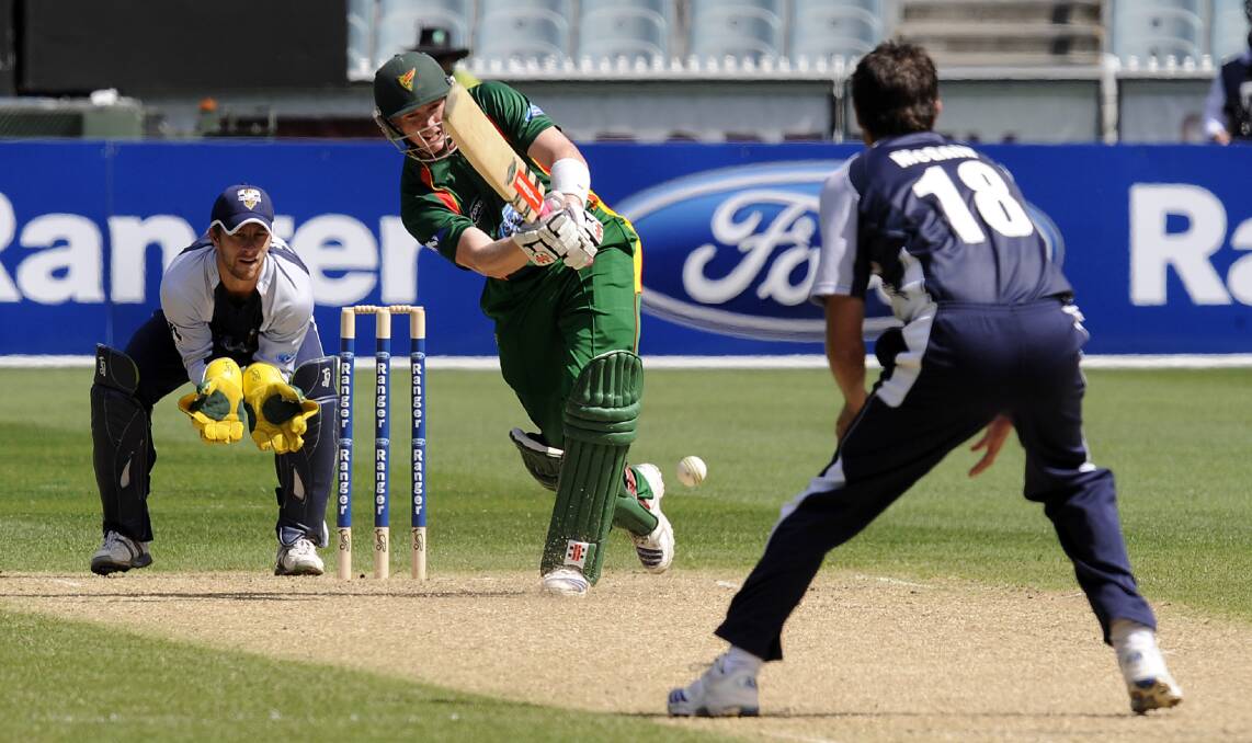 On the road again: Tasmanian captain George Bailey among the runs during a one-day game at the MCG in 2009.