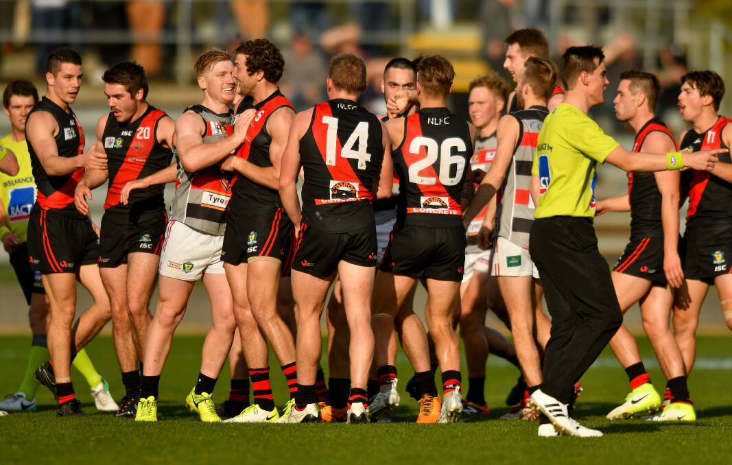 GATHERING: Lauderdale and Northern Bombers players clash during the State League grand final on Saturday at UTAS Stadium. Picture: Scott Gelston.