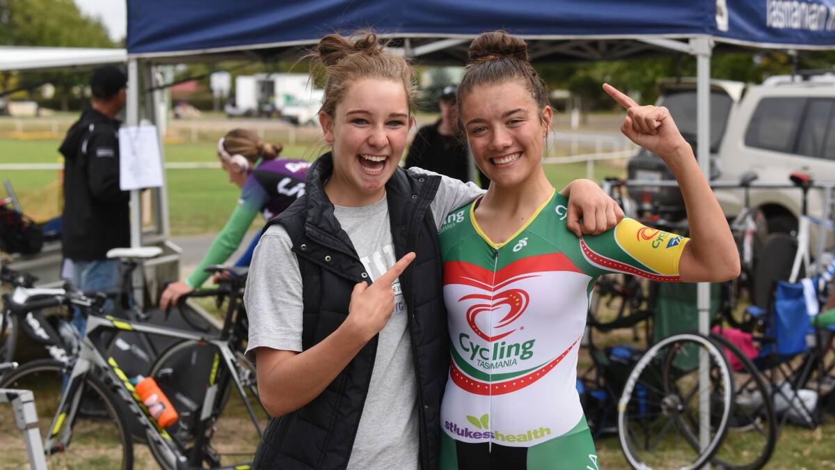 Team work: Last year's Oceania under-19 champion Madeleine Fasnacht congratulates this year's Anya Louw after the time trial at Evandale on Friday. Picture: Paul Scambler