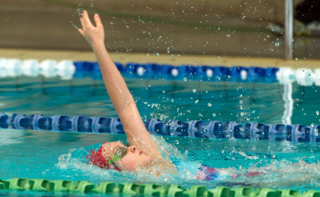 Ford engine: Chelsea Ford contests the backstroke at St Patrick's College's swimming carnival. Pictures: Phillip Biggs