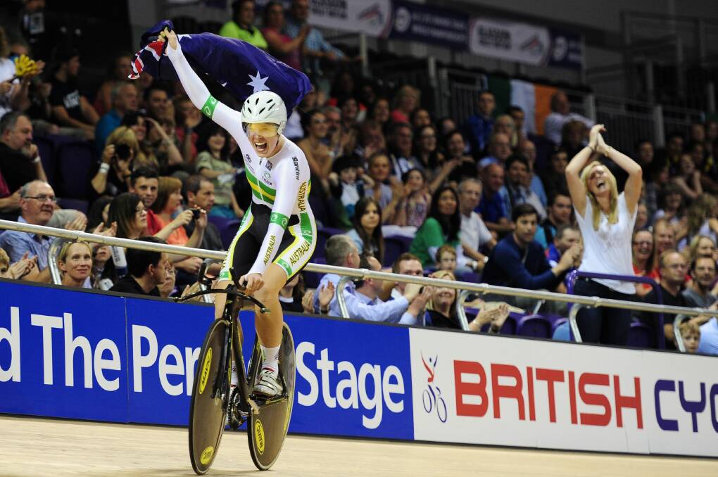 Perry celebrates her individual pursuit junior world title in Glasgow in 2013.