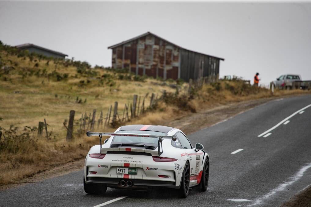 On the up: Victorian Matt Close climbs a rise in his Porsche GT3.