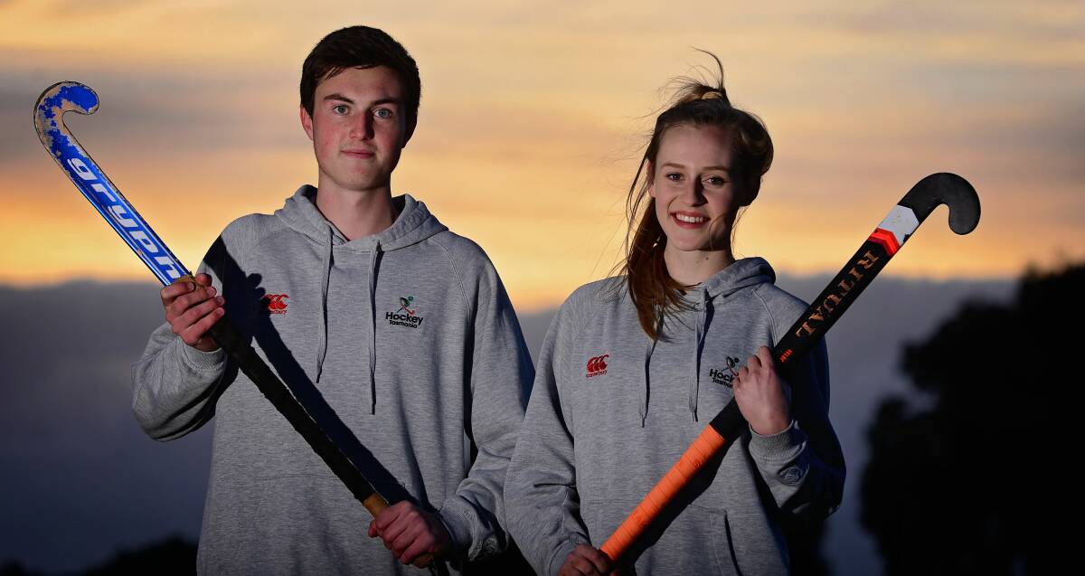 New horizon: Tasmanian hockey players Finn Bailey and Miranda Grant at St Leonards this week. Picture: Phillip Biggs