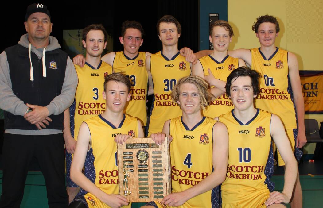 Happy days: Coach Rick Wyllie with the victorious Scotch Oakburn basketball team.