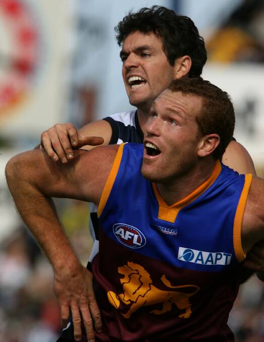 Key match-up: Justin Leppitsch in his playing days with Brisbane, taking on Geelong's Matthew Scarlett in 2006. 