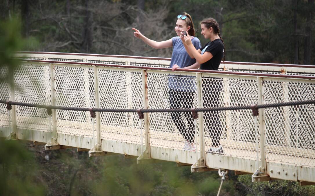 SNAPPED: Launceston locals Nikki DeWit, 17, and Jewel Elliot, 18, snap photos of the Cataract Gorge. Picture: Monte Bovill