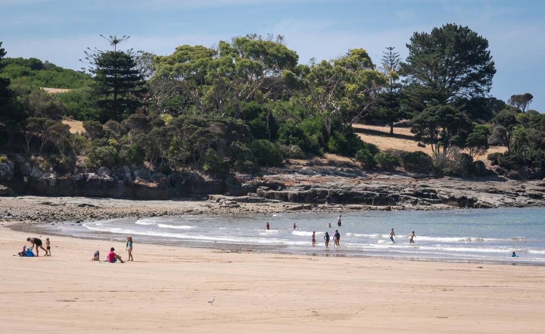 BEACH WEATHER: Beach-goers have taken advantage of January's warm conditions at the Bluff at Devonport. Picture: Simon Sturzaker. 