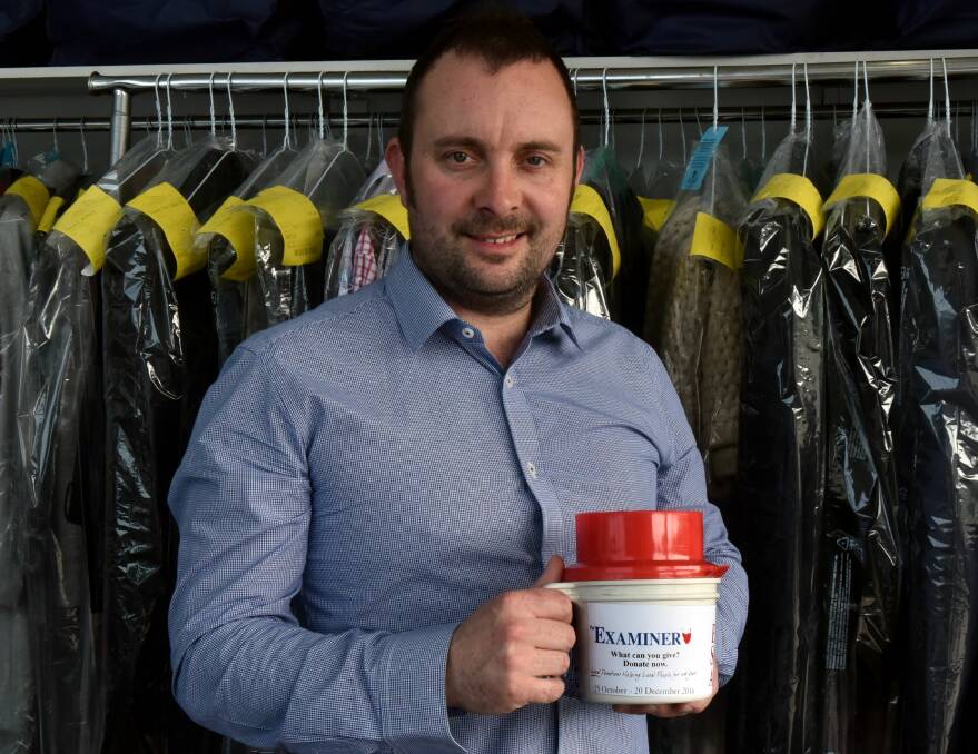 SUPPORT: Regal Dry Cleaners owner Mark Husband helping raise money for the Empty Stocking Appeal. Picture: Neil Richardson