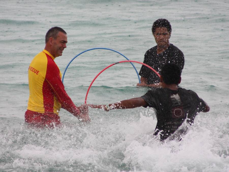 EDUCATE: Lifeguards teach the Samoan community about water safety. 